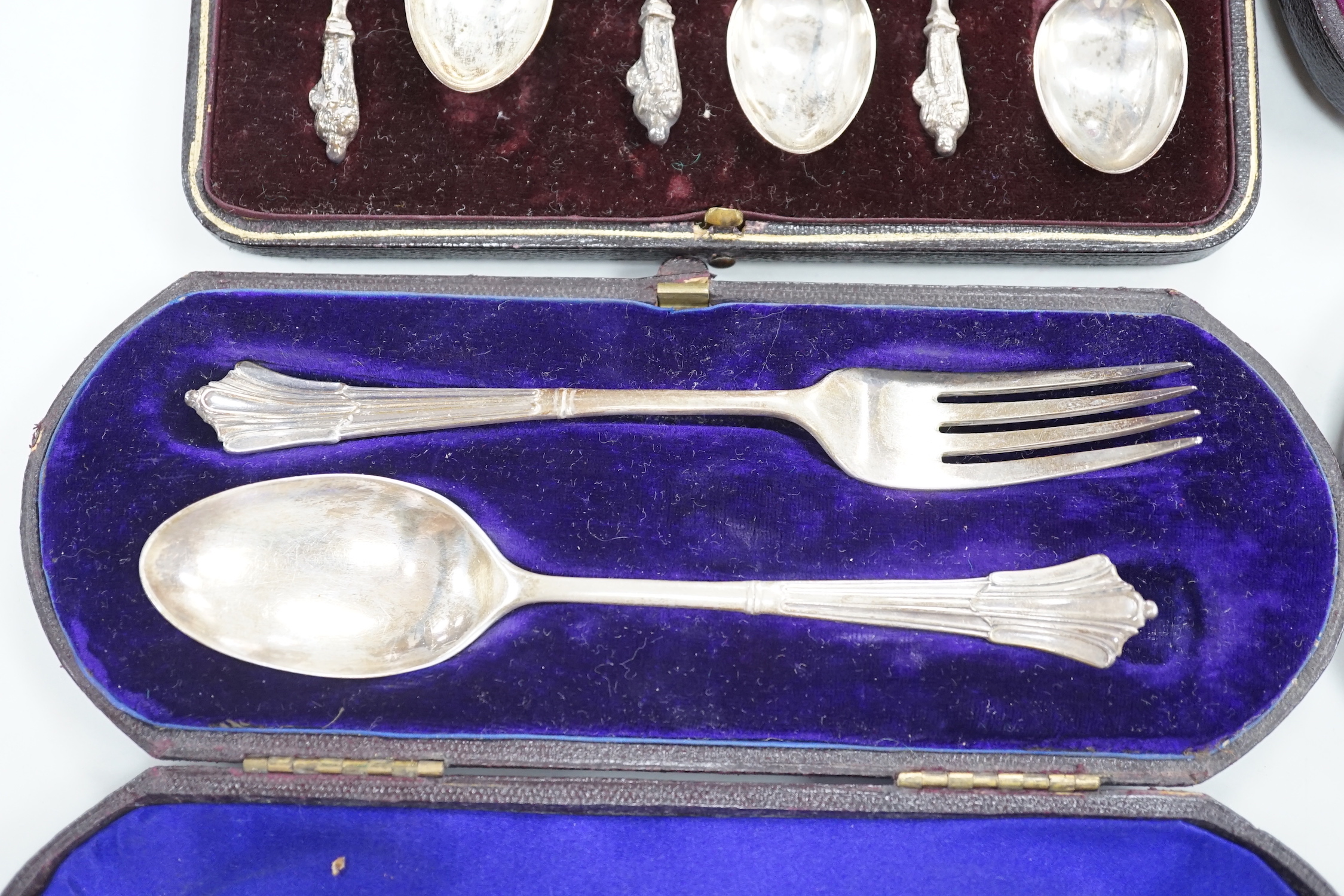 Four cased sets of silver cutlery including apostle spoons and christening sets.